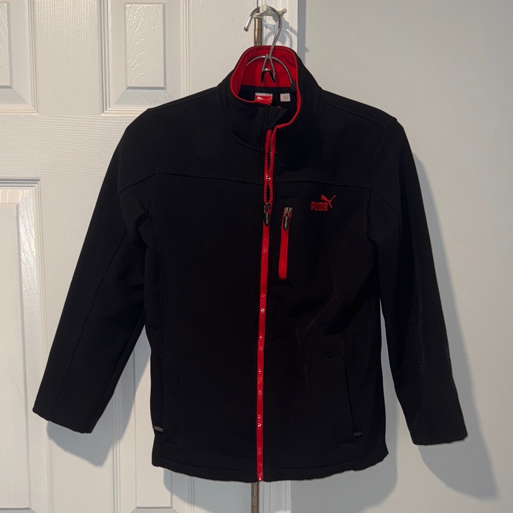 Puma Black Jacket with Red Highlights wind and rain resistant great condition. .